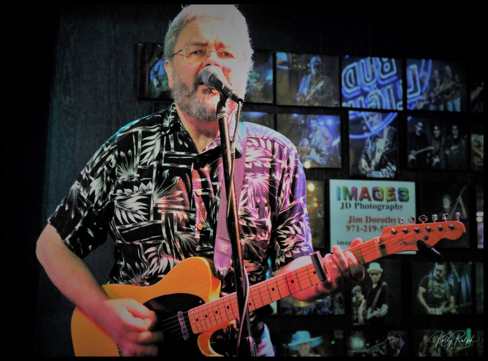 Band performing under vibrant stage lighting